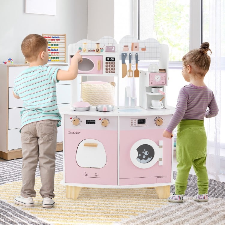 Wooden kids kitchen playset in pink featuring a coffee maker, stove, and realistic knobs for imaginative play.