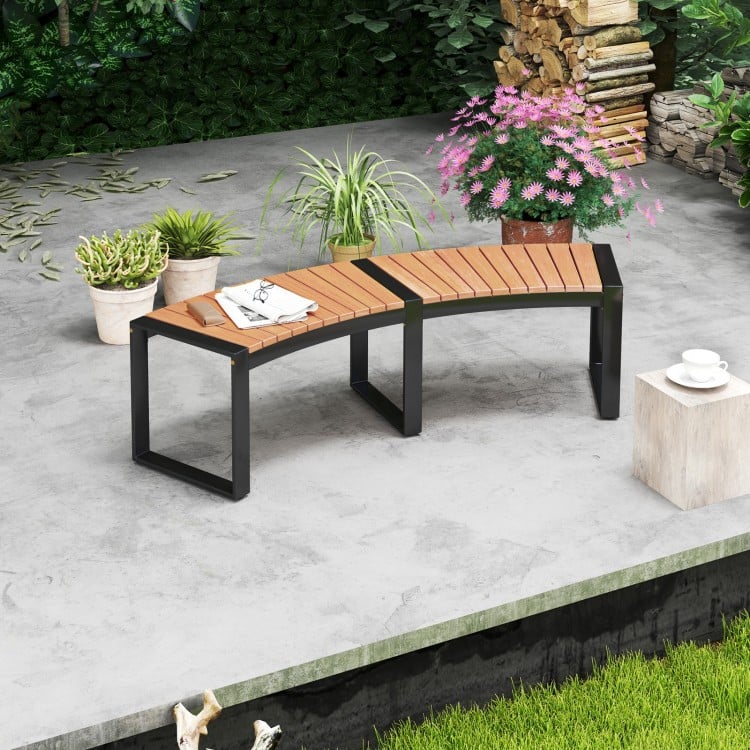 Curved patio bench with acacia wood slatted seat and metal legs, ideal for backyard or poolside relaxation.