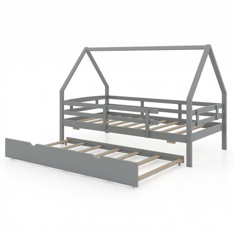 Twin gray house bed with pull-out trundle and protective fence rails, perfect for children's sleepovers and safety.
