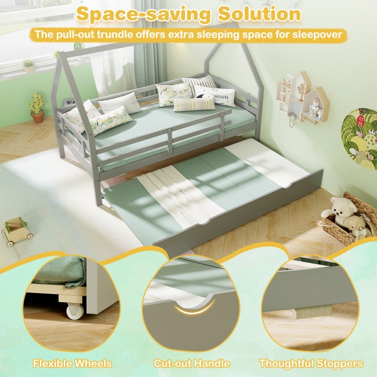 Twin house bed in gray with pull-out trundle, flexible wheels, and protective fence for safe sleepovers.