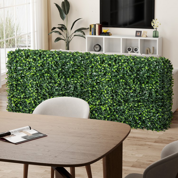 Faux greenery room divider hedge wall in a living room, made of durable PE material for stylish privacy and decor.
