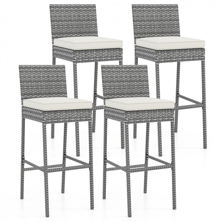 Set of 4 patio wicker barstools with soft seat cushions and cozy footrests, ideal for backyard or poolside use.