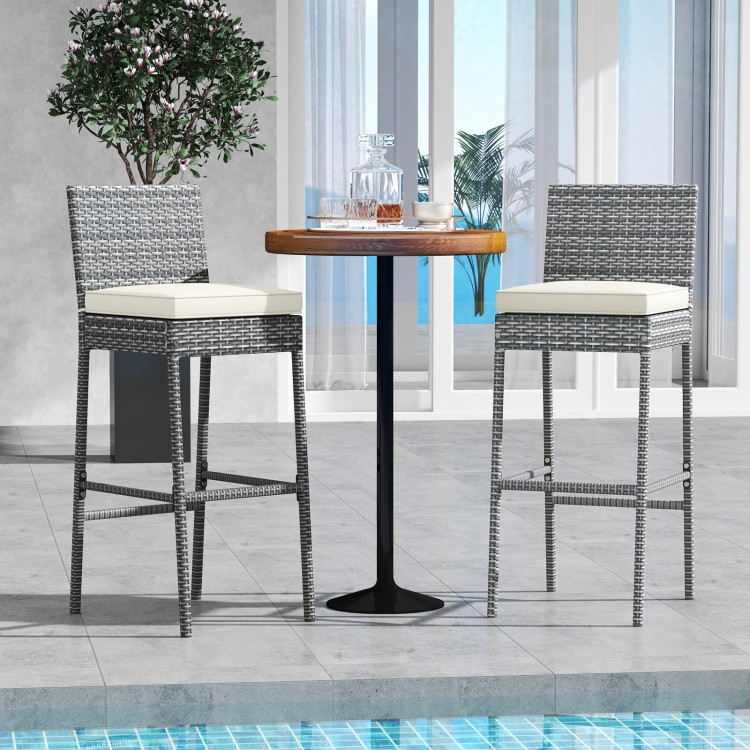 Set of 2 patio wicker barstools with soft cushions, 30" seat height, ideal for poolside or balcony use.