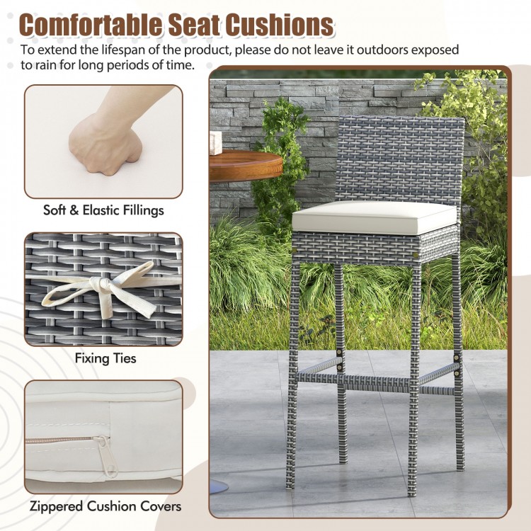 Patio wicker barstool with soft seat cushion, cozy footrest, and fixing ties, ideal for backyard or poolside use.