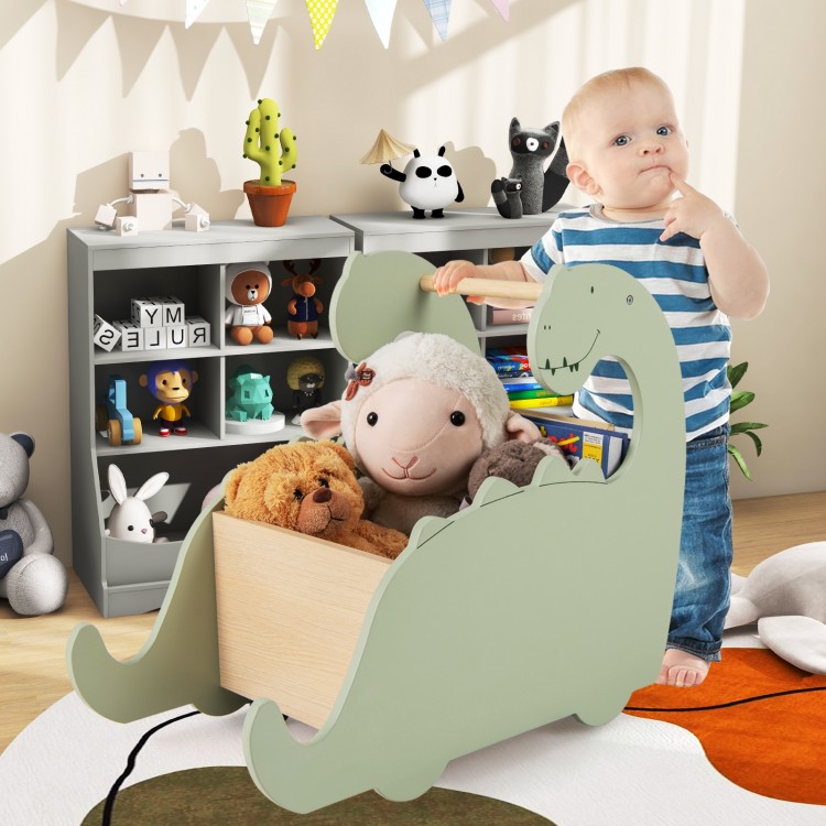 Dinosaur-shaped baby push walker in green with pine wood handle, serving as a storage organizer for toys.