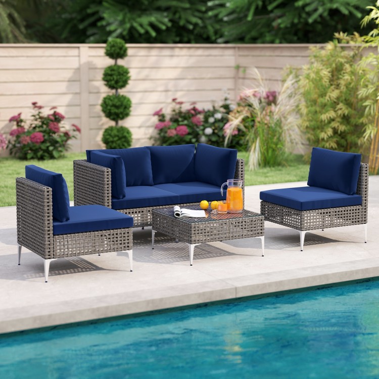 5-piece outdoor furniture set featuring navy cushions, elegant PE rattan, and a tempered glass coffee table by the.