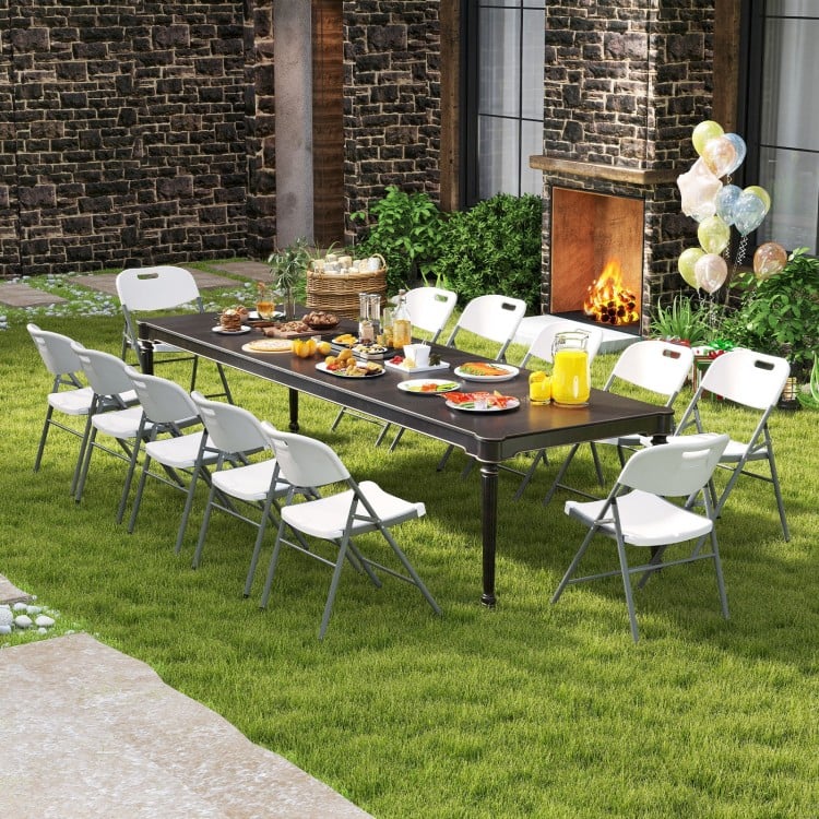 Folding stackable chairs with metal frame in white, ideal for outdoor gatherings and easy storage.