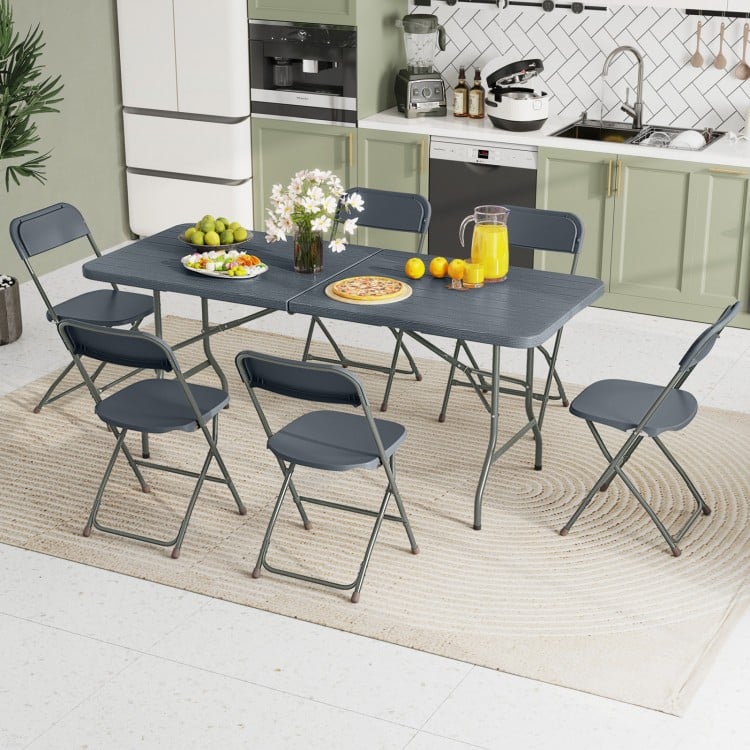 Gray 6-foot folding table with wood grain HDPE top, ideal for indoor or outdoor gatherings, featuring a safe lock.