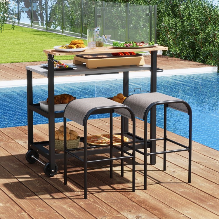 Rolling bar cart with a flip-up table, hooks, and a galvanized metal frame, perfect for outdoor dining and storage.
