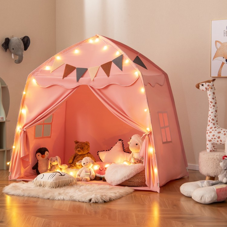 Extra large pink kids play tent with string lights, featuring a boho design and spacious interior for playtime fun.