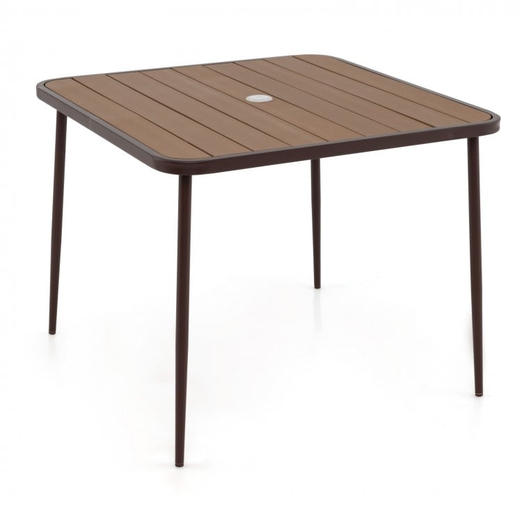 Square plastic wood slatted tabletop with umbrella hole, part of a 5-piece patio dining set for outdoor relaxation.