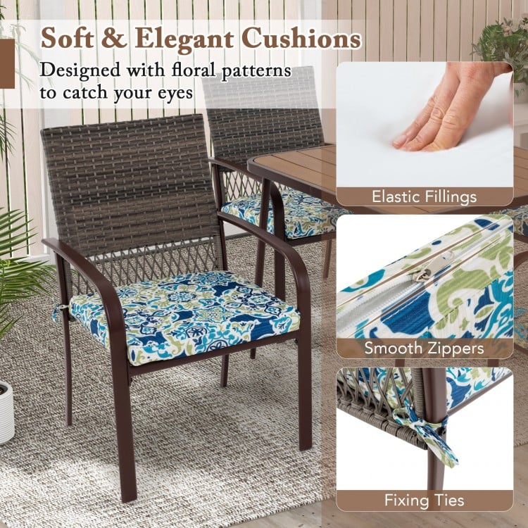 Cushioned rattan armchair with floral pattern seat, featuring elastic fillings and smooth zippers for outdoor dining.