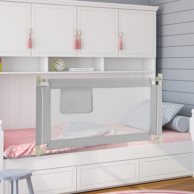 Toddler bedrail in gray with side pocket, featuring 24 adjustable heights for safety and convenience in any bed type.