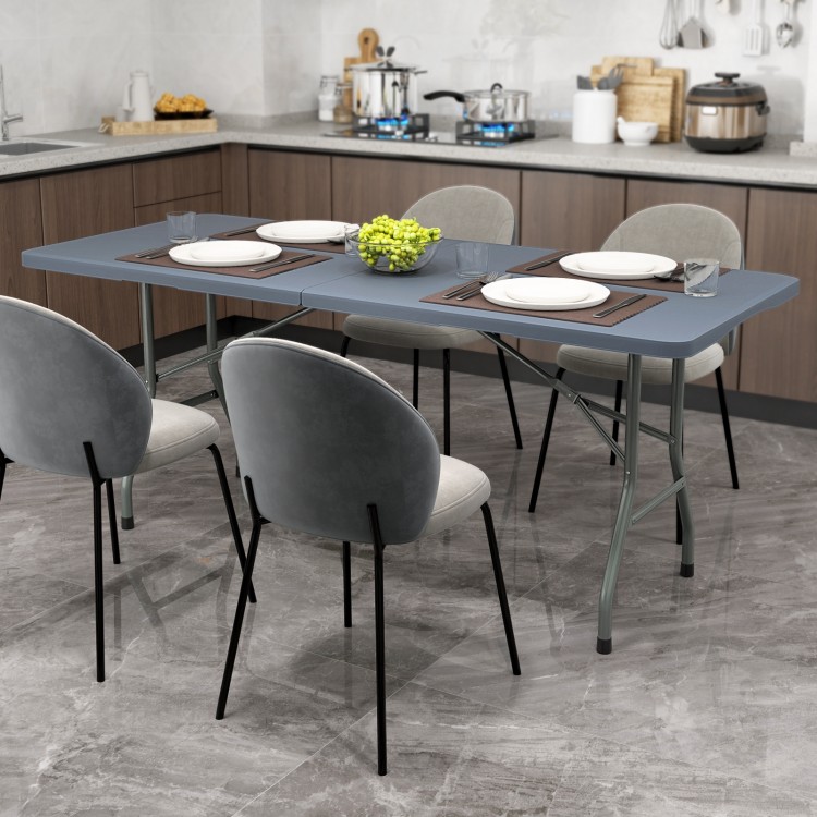 Portable 6 ft folding table with gray HDPE tabletop, ideal for indoor or outdoor use, supporting up to 350 lbs.