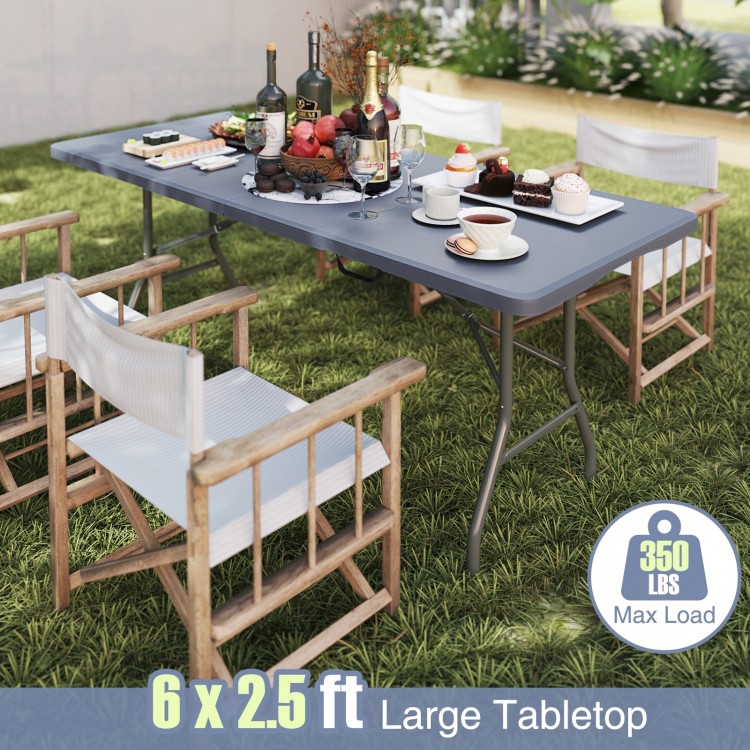 Portable 6 x 2.5 ft folding table with gray HDPE tabletop, 350 lbs capacity, ideal for outdoor picnics and gatherings.