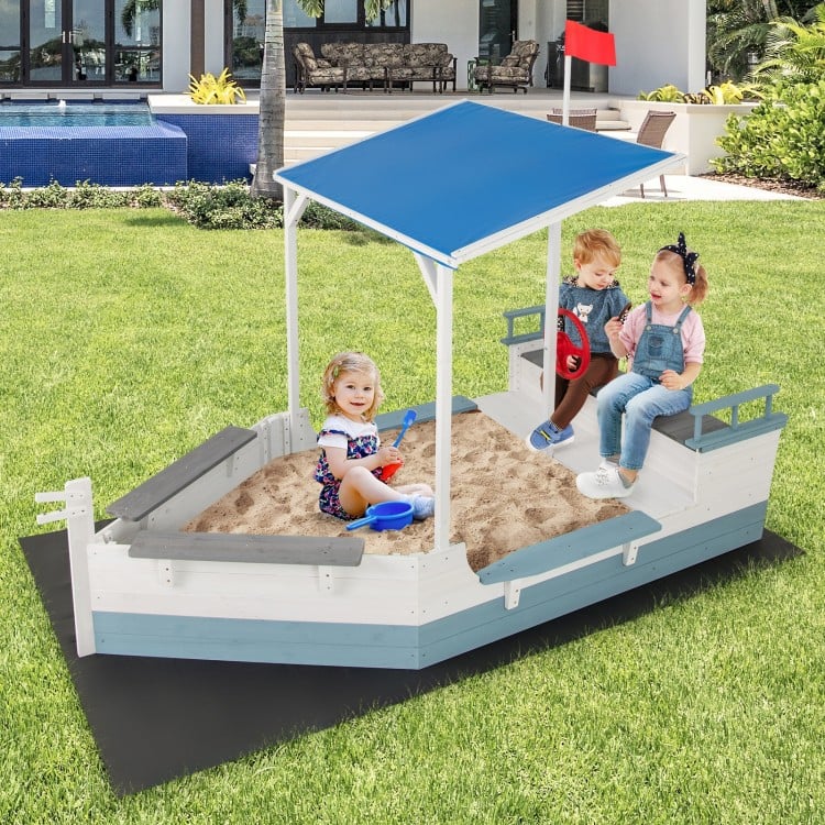 Pirate ship sandbox with canopy, built-in benches, and storage compartments for backyard fun and shade.
