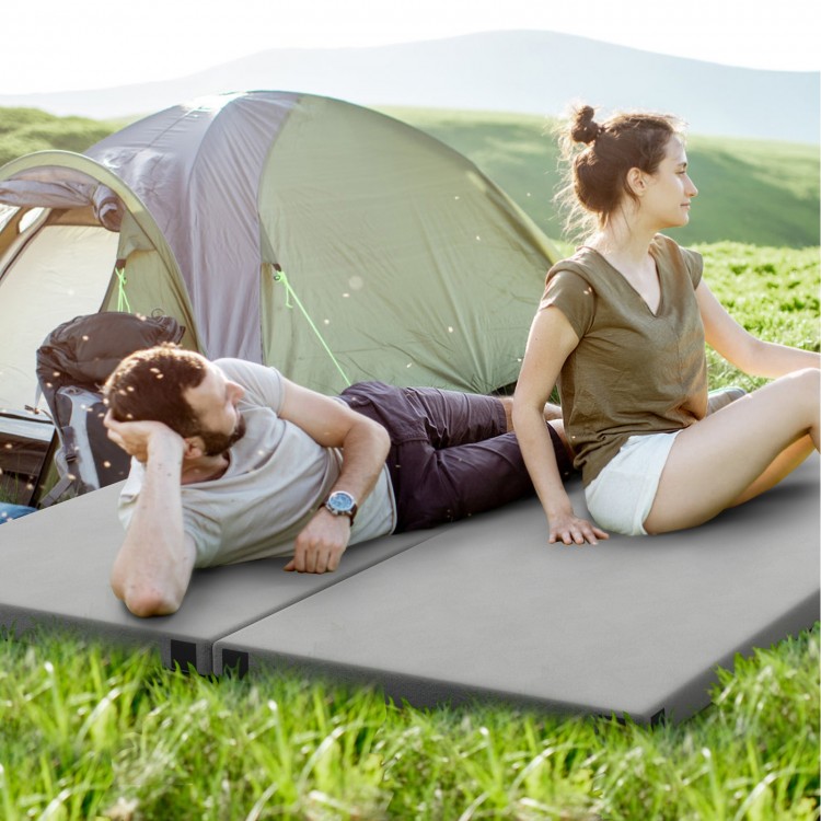 Foldable camping mattress in gray with high-density foam, shown outdoors for comfortable sleeping during camping trips.
