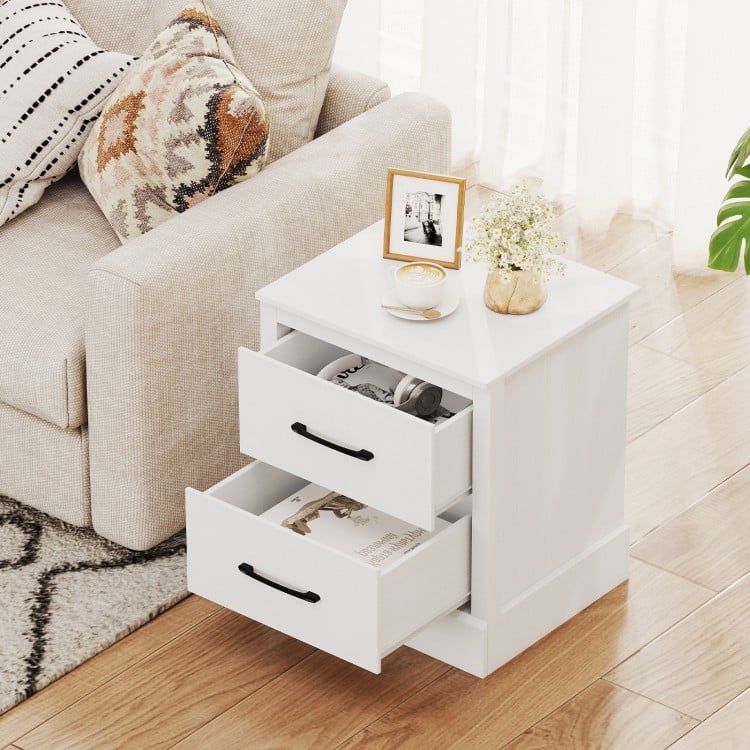 White wood compact nightstand with two pull-out drawers, perfect for storage in living room or bedroom.
