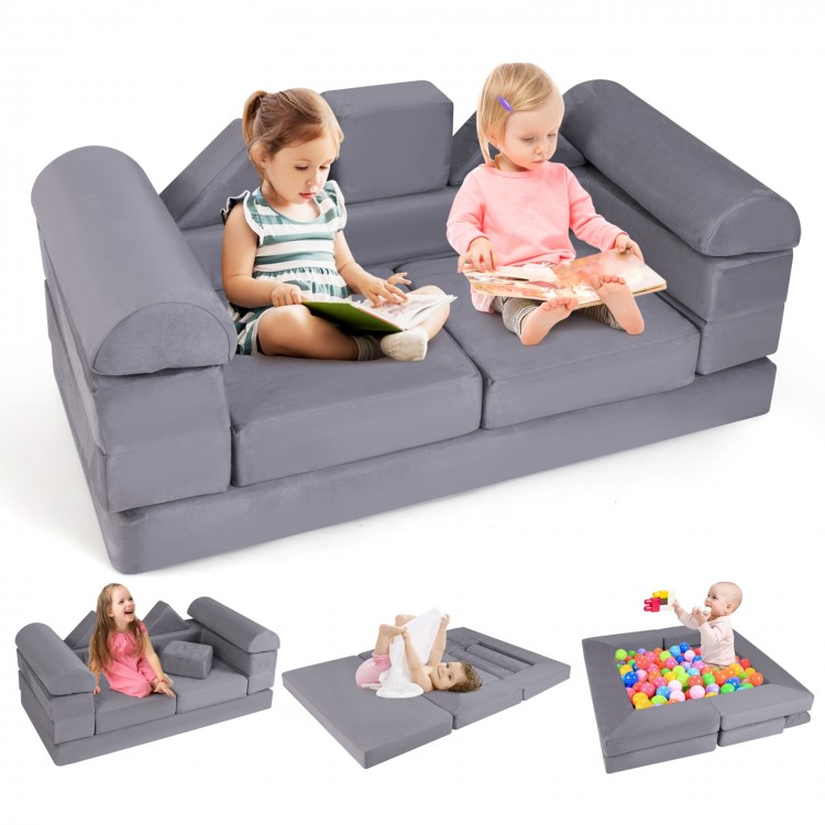 Gray 9-piece foam playset with kids lounging, convertible to couch or ball pit, made of breathable suede fabric.