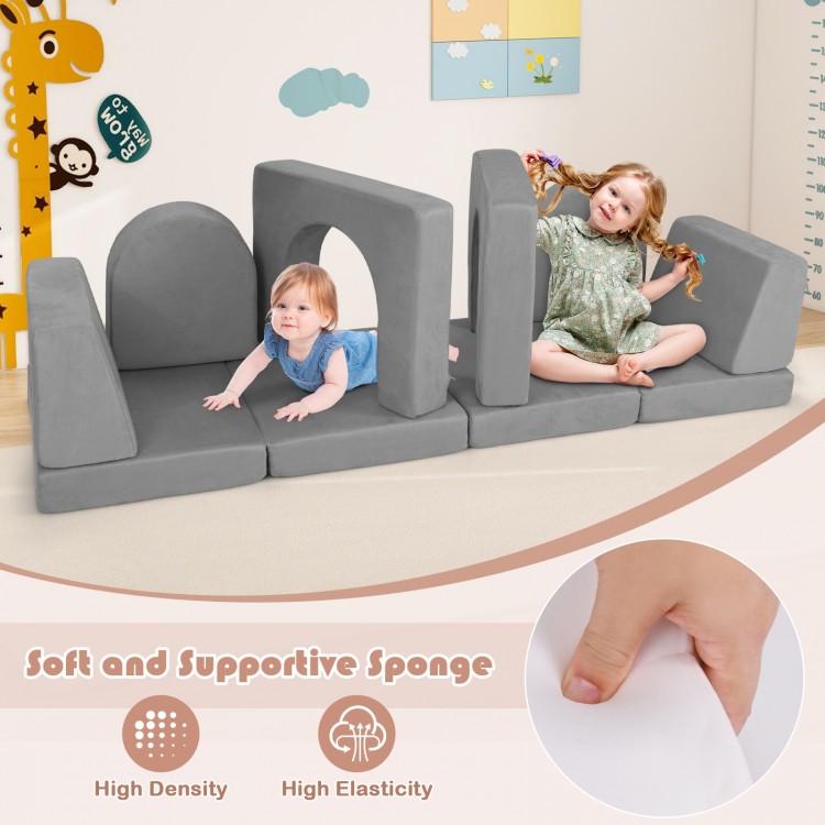 Gray suede modular kids play couch with soft, supportive sponge blocks arranged for fun and safe playtime activities.