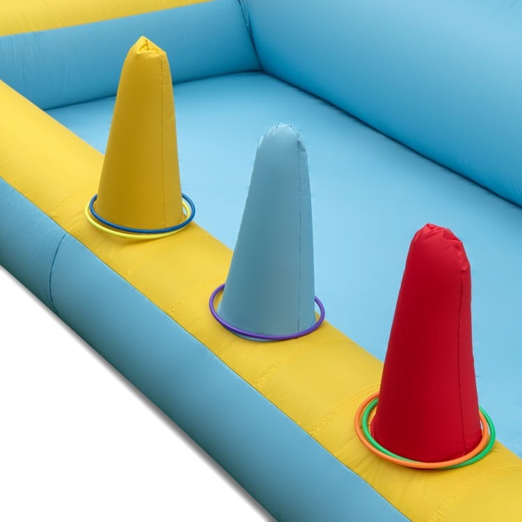 Colorful inflatable bounce house with slide and tunnel, featuring cones and rings for kids' fun and safe play.