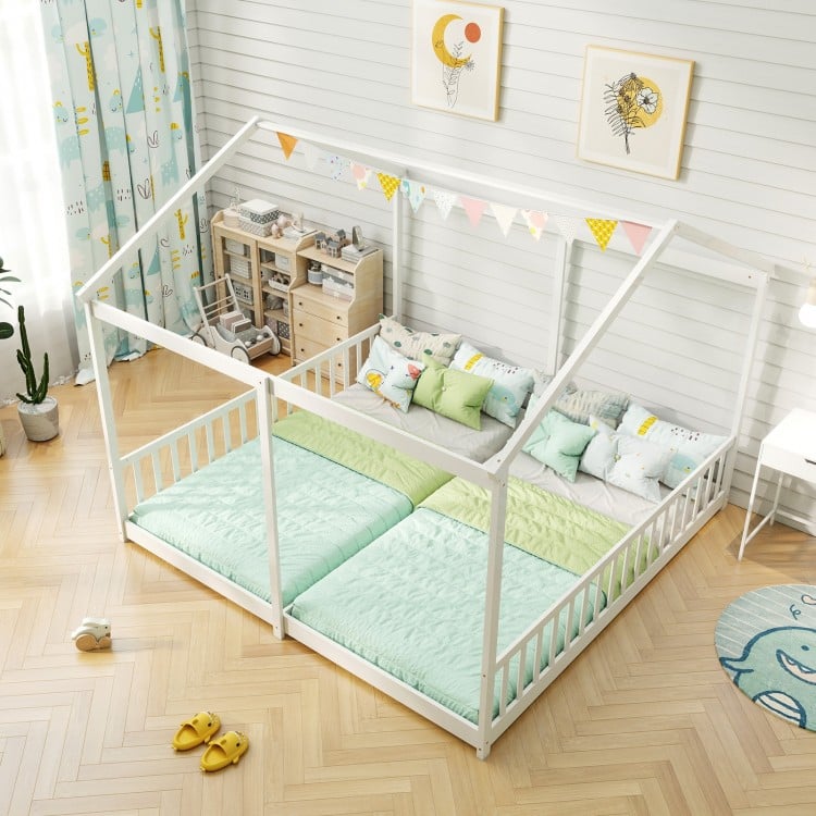 House-shaped double floor bed for twins in white with safety guardrails, ideal for shared sleeping for kids.