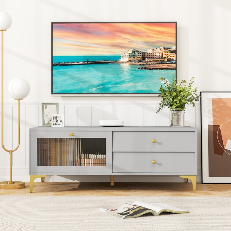 Gray TV stand with drawers and compartment, designed for 55-inch TVs, featuring elegant glass and sturdy metal legs.