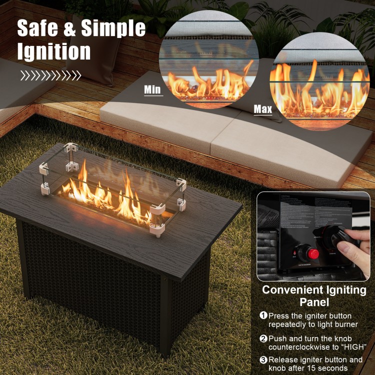 50000 BTU propane gas fire pit table with wind guard, showcasing flames and glass rocks for outdoor warmth and elegance.