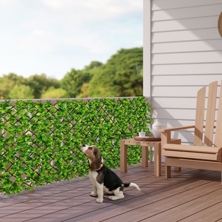 Expandable fence privacy screen with realistic faux eucalyptus leaves, perfect for balcony or patio privacy.