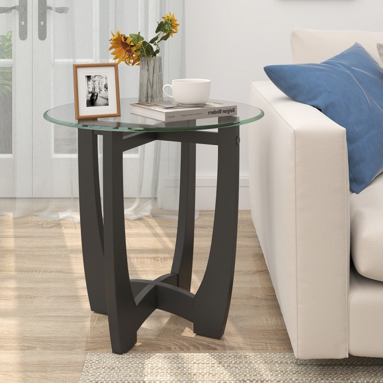 Round end side table with a tempered glass tabletop and black rubber wood frame, perfect for drinks and decor.