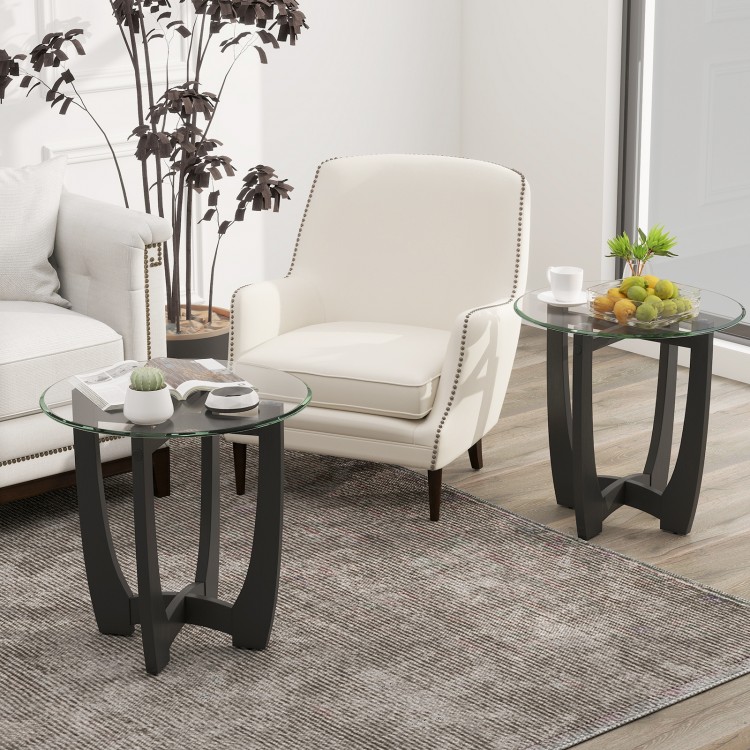 Round end side table with tempered glass tabletop and black rubber wood frame, perfect for contemporary living spaces.