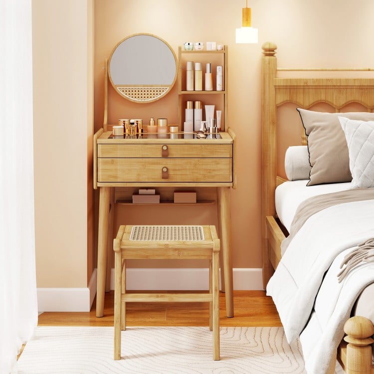 Small bamboo vanity desk set with mirror, 2 drawers, and stool, ideal for compact bedrooms and stylish storage.