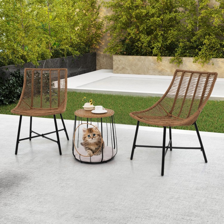 Two ergonomic brown rattan chairs with a pet house side table, perfect for outdoor patio relaxation.