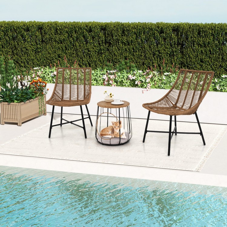 Two ergonomic brown rattan chairs with a pet house side table, perfect for outdoor patio relaxation by the poolside.