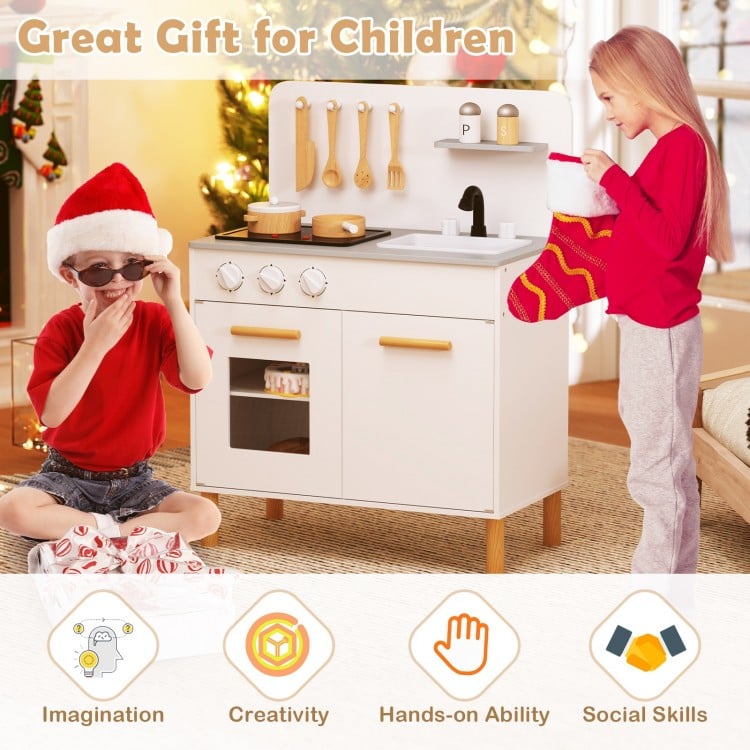 Kids kitchen playset in white with dual stoves, cooking accessories, and storage for imaginative role-playing fun.