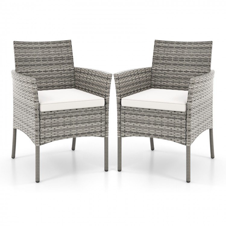 Set of 2 outdoor PE rattan armchairs with white seat cushions, designed for comfort and stability in patio or garden.