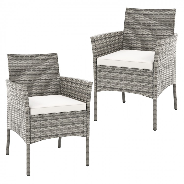Two outdoor PE rattan armchairs with white seat cushions, featuring a sturdy frame and cozy design for patio relaxation.