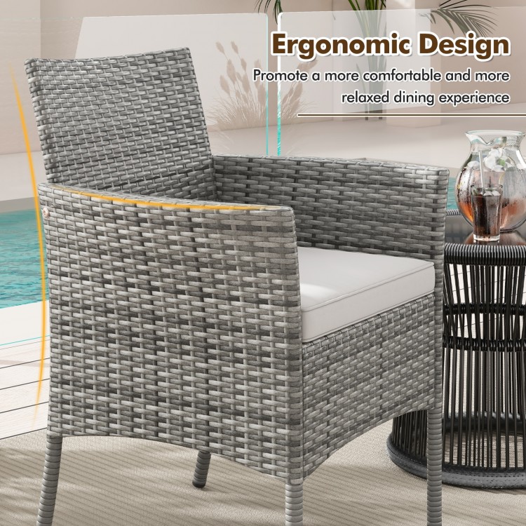 Ergonomic outdoor PE rattan armchair with cozy white seat cushion, ideal for poolside and patio relaxation.