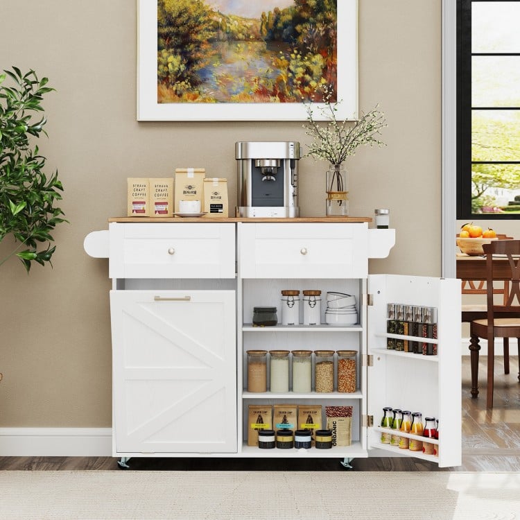 Rolling kitchen island in white with drop leaf top, storage drawers, and trash can cabinet, perfect for kitchen.