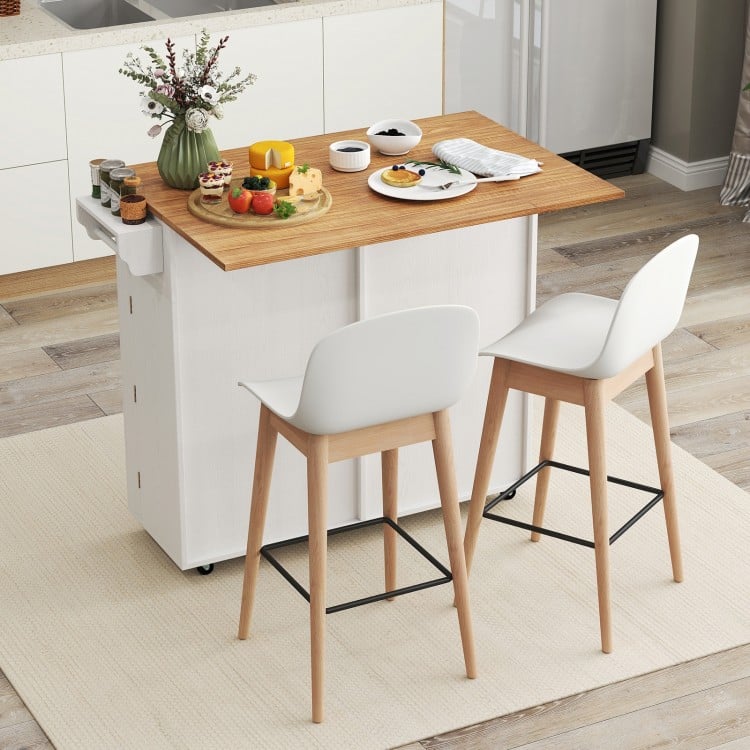 Rolling kitchen island with a spacious drop leaf top, two storage drawers, and rubber wheels for easy mobility.