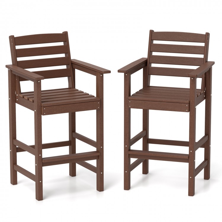 Set of 2 brown HDPE Adirondack bar chairs with wide armrests, slatted seats, ideal for outdoor patio use.