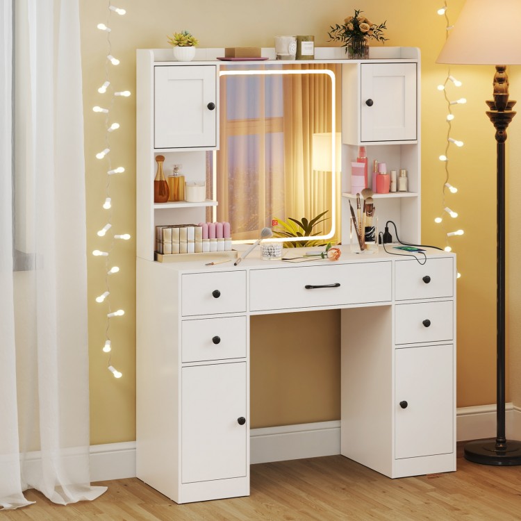 Makeup vanity desk in white with lighted mirror, adjustable shelves, and charging station for convenient storage.