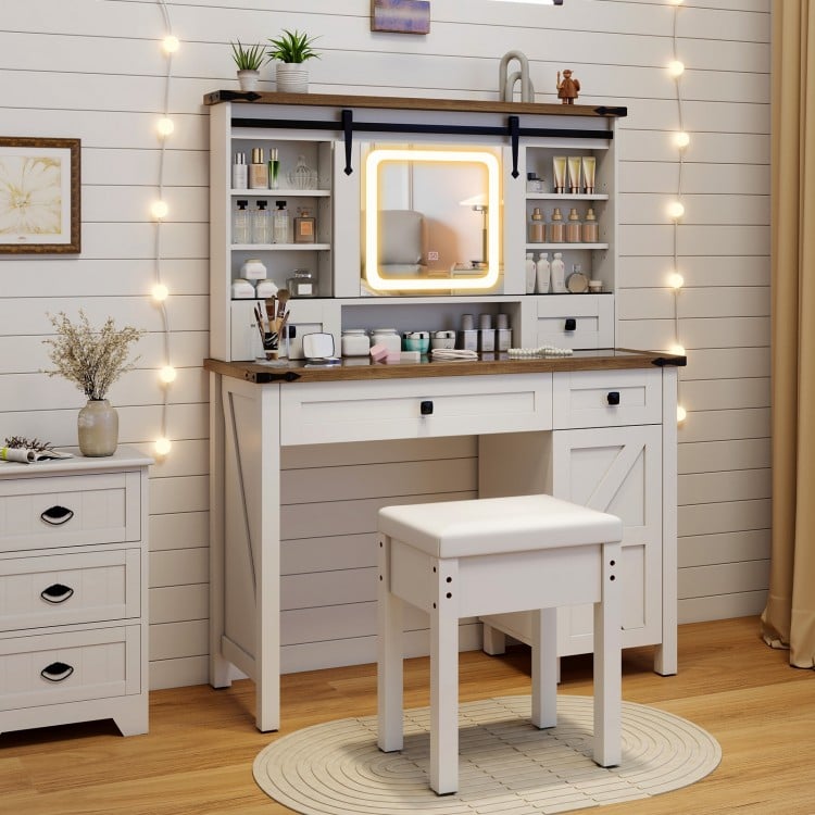 Makeup vanity desk in white with LED mirror, matching stool, and adjustable shelves for organized beauty essentials.