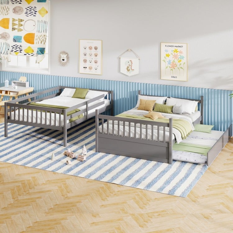 Full over full gray bunk bed with ladder and trundle, featuring sturdy pine wood frame for children's rooms and compact.