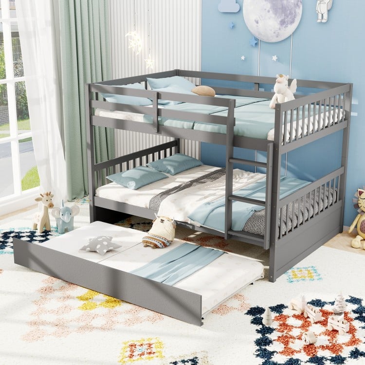 Full over full gray bunk bed with ladder and trundle, featuring sturdy pine wood and modern design for children's rooms.