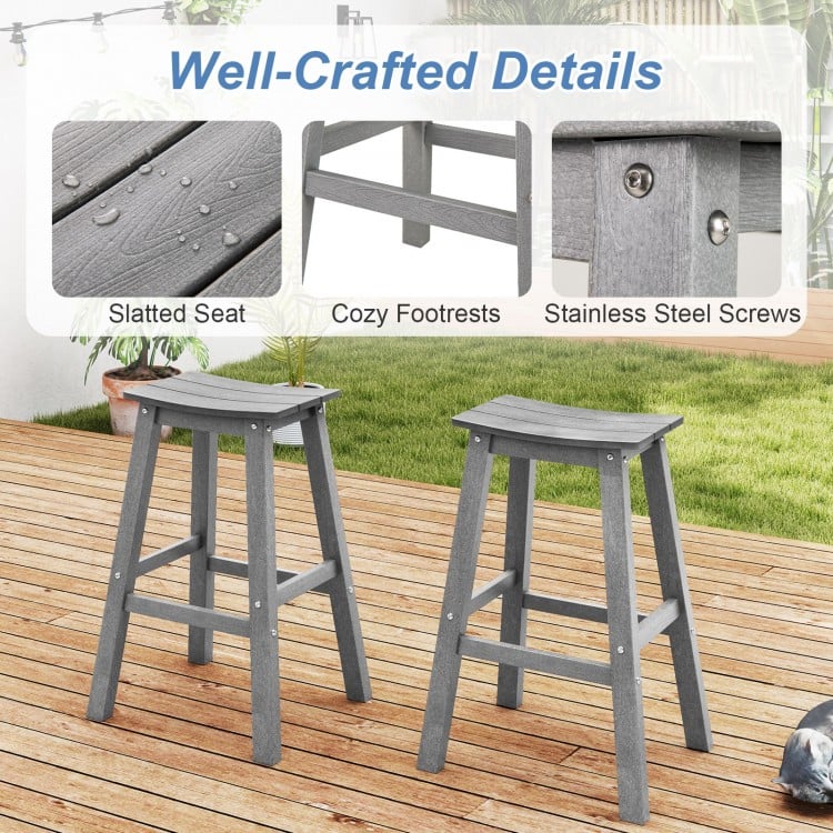 Gray HDPE patio bar stool set of 2 with slatted seats, cozy footrests, and stainless steel screws for outdoor comfort.