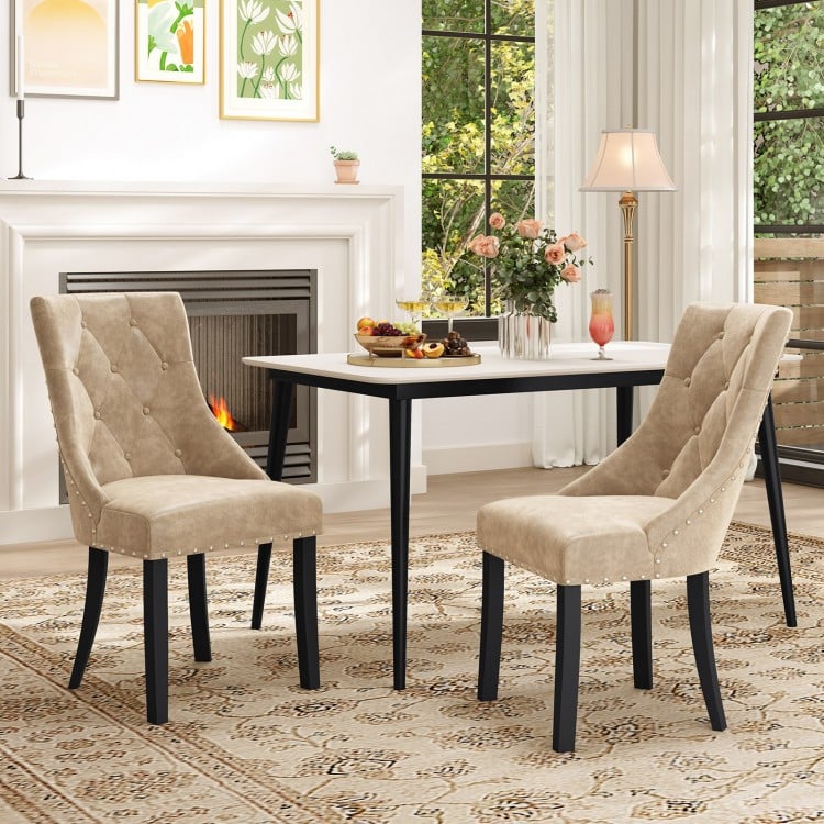 Light brown tufted wingback dining chairs set of 2 with nailhead trim, perfect for enhancing your dining space.