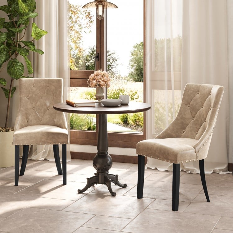 Light brown tufted wingback dining chairs set of 2 with nailhead trim, perfect for enhancing your kitchen or living.
