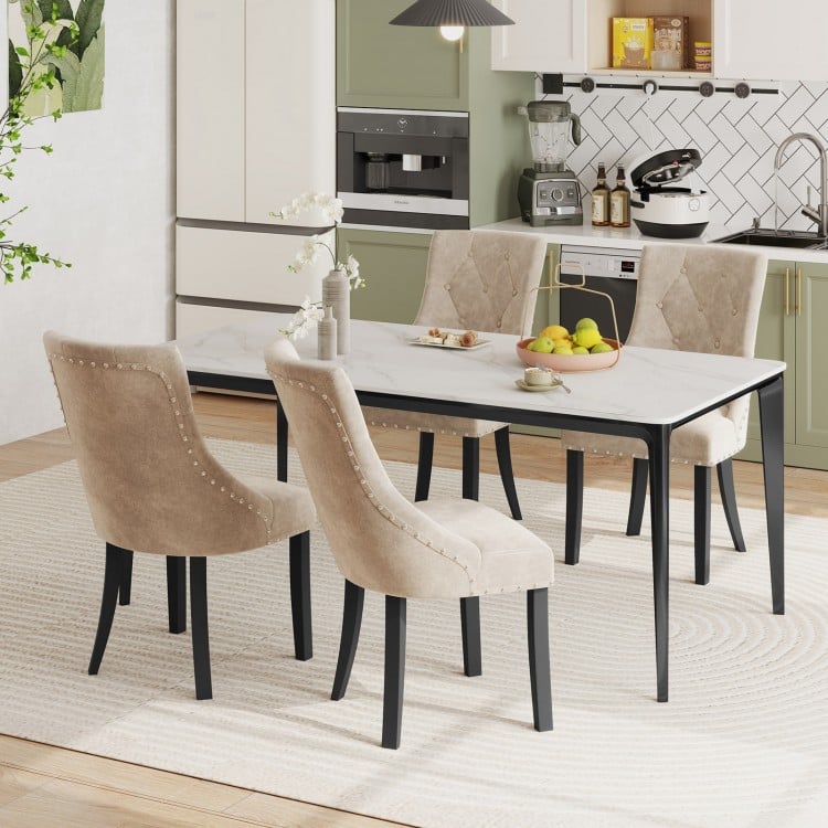 Light brown tufted wingback dining chairs with nailhead trim, set of 2, perfect for stylish kitchen or dining room.