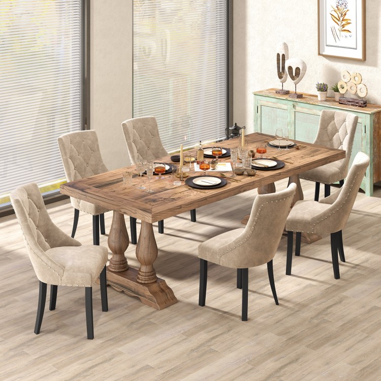 Light brown tufted wingback dining chairs with ergonomic support, stylish design, and durable rubber wood frame.